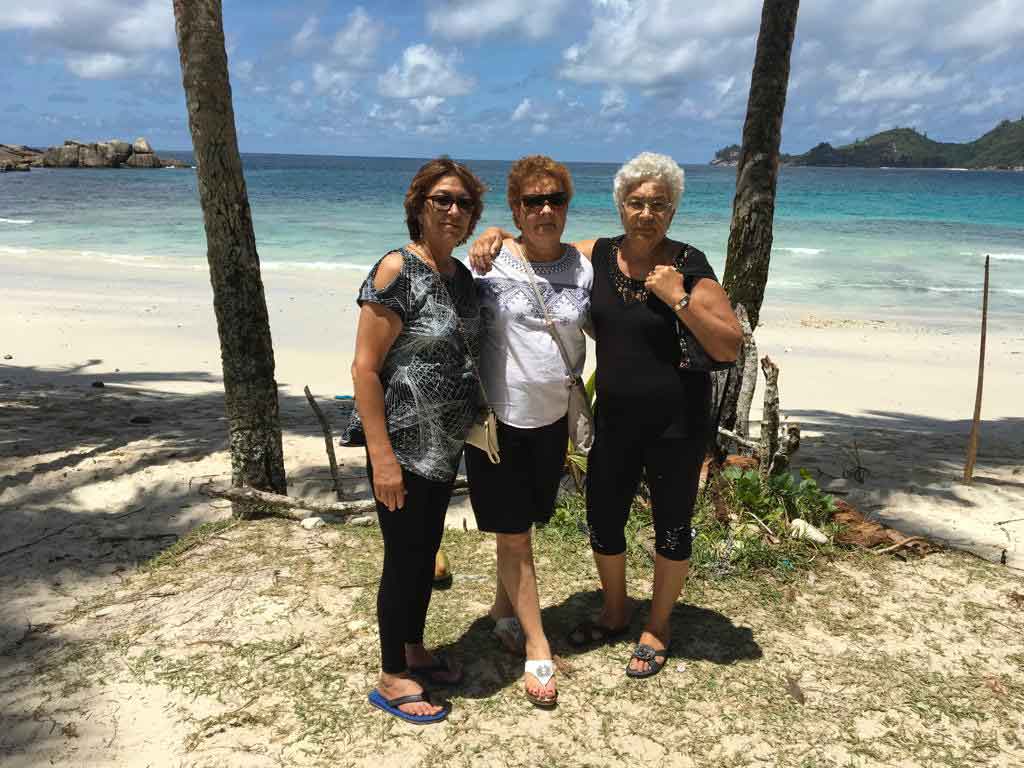 Fun times: Sisters Anuota, left, and Juliana join Carlette outside La Batista, her favourite place to relax for lunch and music