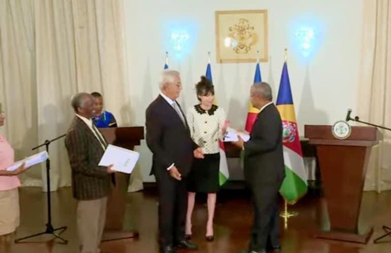 Handover: The Commission report is presented to President Ramkalawan by Gabrielle McIntyre
