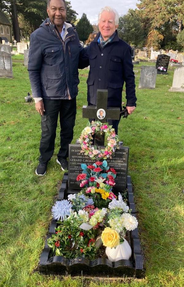 Team players: Lewis Betsy and Tim Jackson at the grave of Gerard Hoarau in Hounslow
