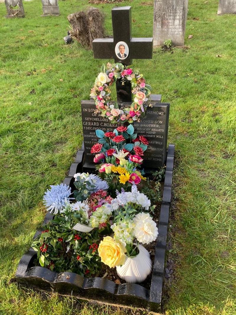 Poignant: Gerard’s grave decorated with flowers