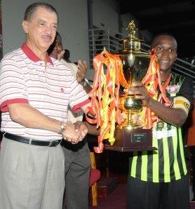 Honour: Don Anacoura awarded the trophy with President Michel