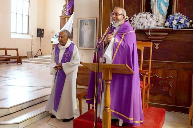 Taking the service: Father Roger de Commarmond, left, and Father Collin Underwood