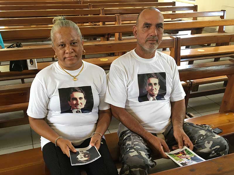 Dedicated: A couple wearing T-shirts with Gerard’s photo