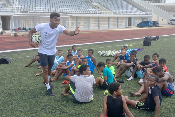 Top coach: Kevin helps youngsters in Seychelles attending a Kevin Betsy Foundation session