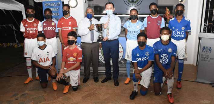 Ready for the tournament: President Ramkalawan, and British High Commissioner Patrick Lynch, centre,  with players in the Premier League team strips