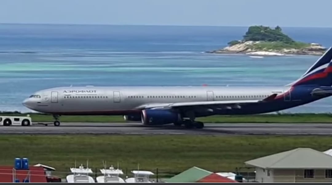 Secure: The Aeroflot passenger jet being towed away to a place of safety at Seychelles International Airport