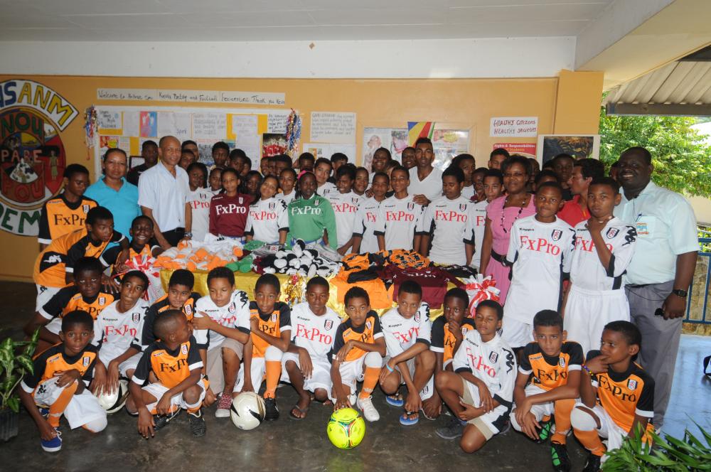 All together: Kevin (centre back) with youngsters at the Belony School and members of the Seychelles Football Federation