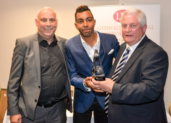 Honour: Kevin, with manager Garry Hill, left, and Woking legend Geoff Chapel, is presented with the trophy for Outstanding Contribution to Woking Football Club