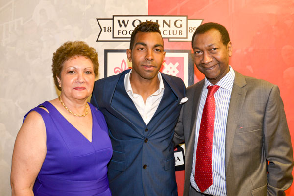 Pride: Kevin Betsy with his parents Julie and Lewis