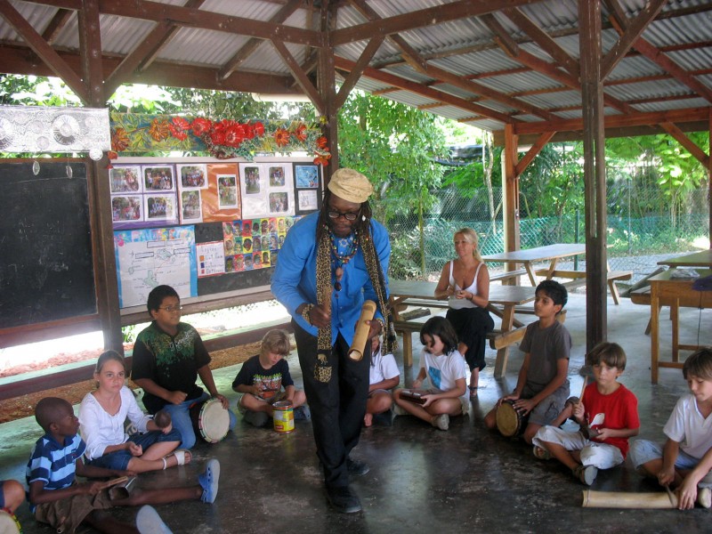 Peace man:  Achille Kwame Luc with young tourists in Seychelles