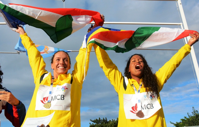 All smiles: Female lifters Ruby Malvina and Clementina Agricole each won three gold medals, while  Alexus Laird won the women’s 50m backstroke in a record 29.48 seconds