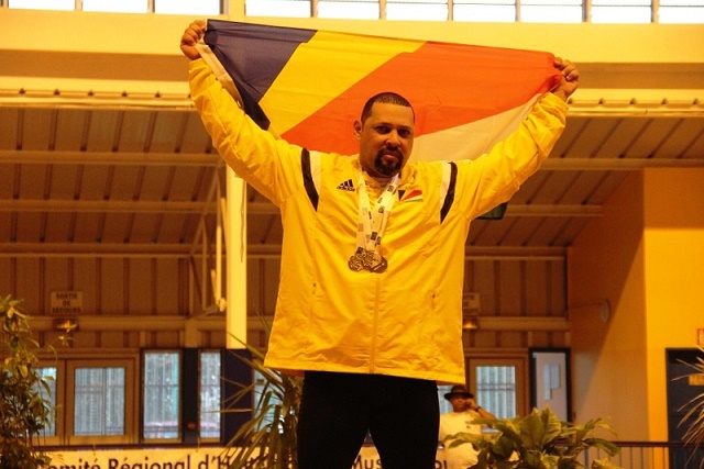 Proud: Weightlifter Steven Baccus took triple gold at the IOIG